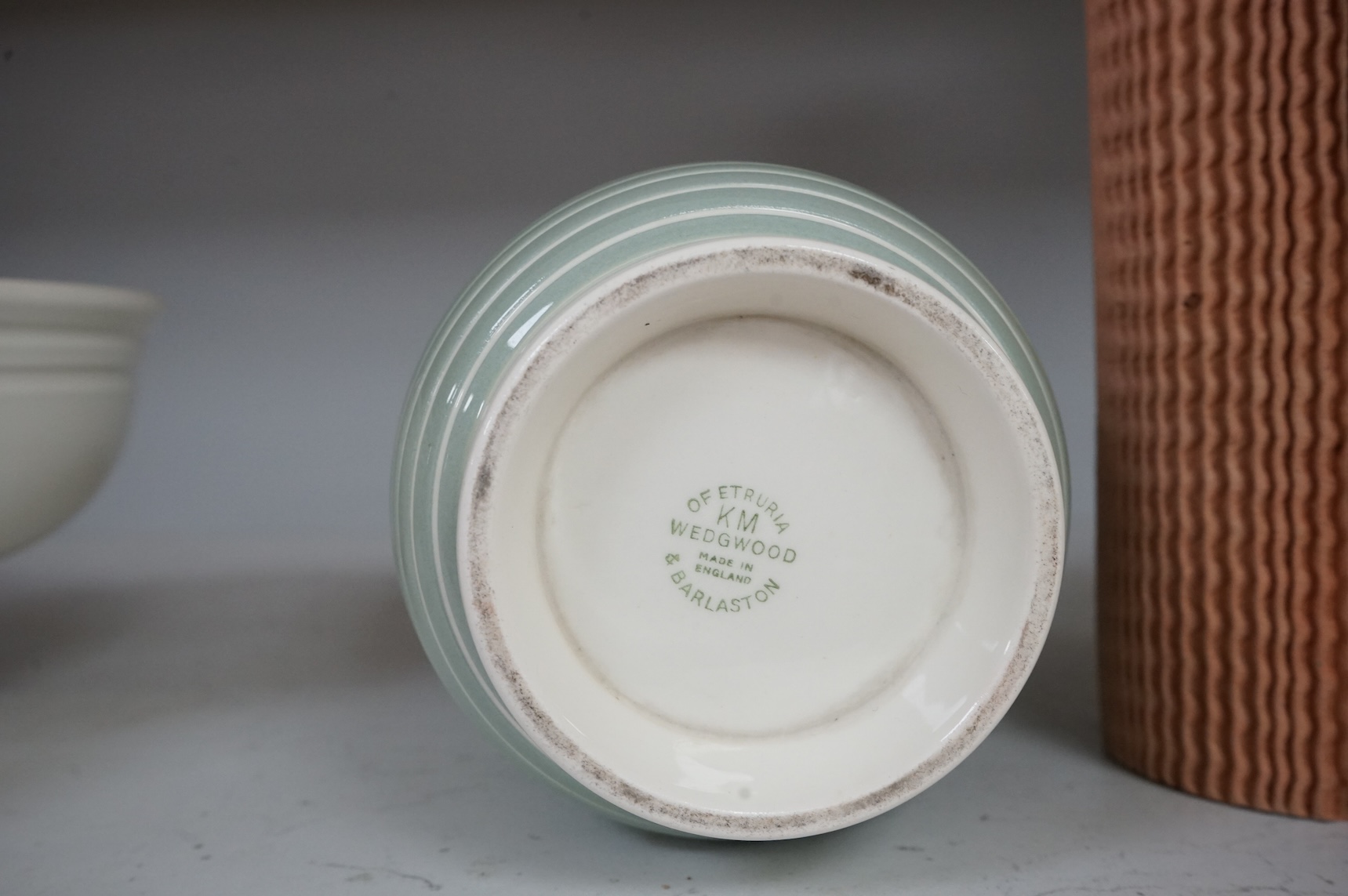 Keith Murray for Wedgwood, a green and cream vase, 18cm high